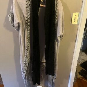 Long black scarf. A bit stretchy fur like.   See pictures